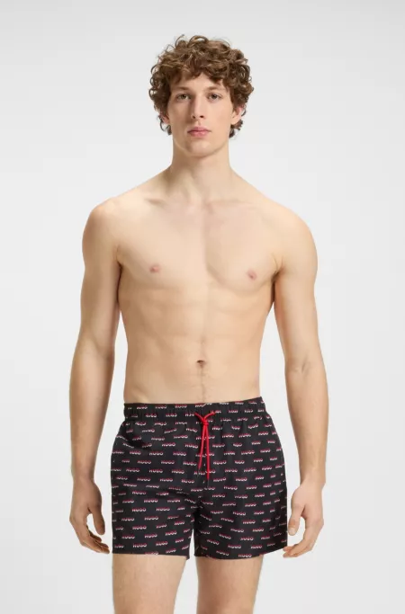 Swim shorts with split-logo print