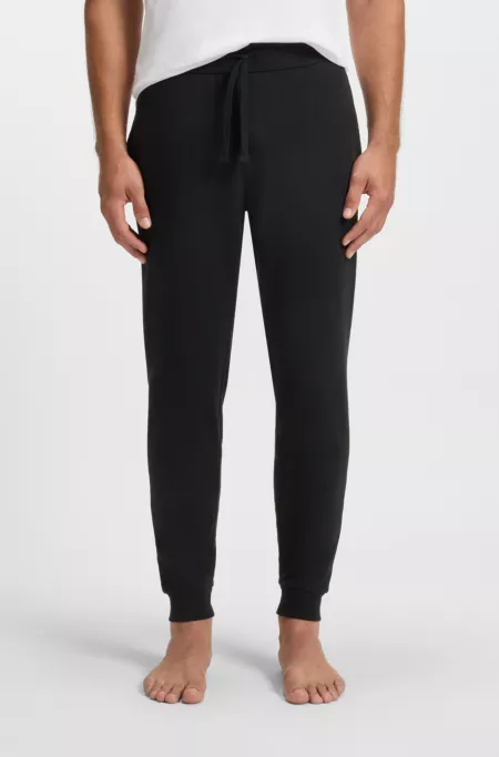 Logo-print tracksuit bottoms in cotton terry