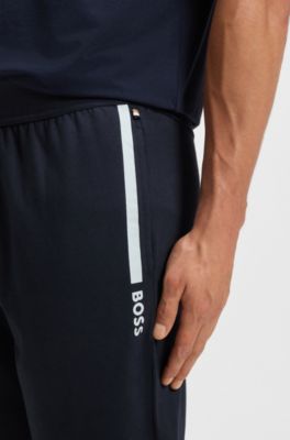 Pantalones de ch&aacute;ndal en felpa de algod&oacute;n con logo estampado, Azul oscuro