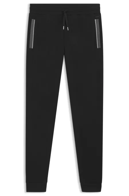 Pocket-detail tracksuit bottoms in a cotton blend