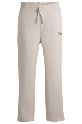 Pantalones de ch&aacute;ndal en felpa de algod&oacute;n con gr&aacute;ficos bordados, Blanco