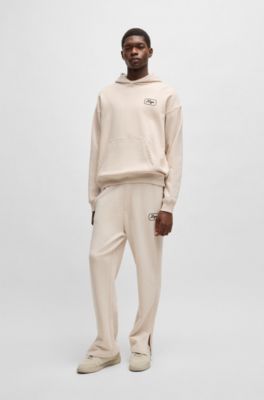 Pantalones de ch&aacute;ndal en felpa de algod&oacute;n con gr&aacute;ficos bordados, Blanco