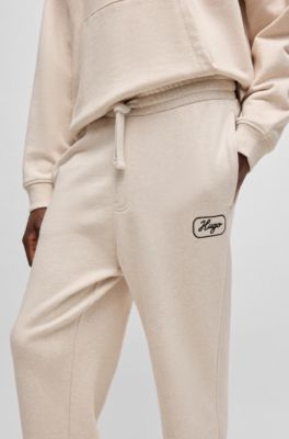 Pantalones de ch&aacute;ndal en felpa de algod&oacute;n con gr&aacute;ficos bordados, Blanco
