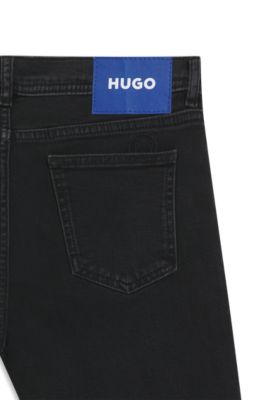 Jeans acampanados de c&oacute;modo denim el&aacute;stico negro, Negro