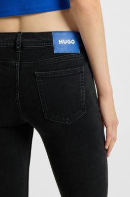 Jeans acampanados de c&oacute;modo denim el&aacute;stico negro, Negro