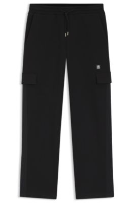 Pantalones de ch&aacute;ndal en mezcla de algod&oacute;n con cinta con motivos geom&eacute;tricos, Negro