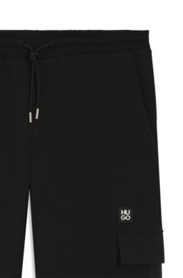 Pantalones de ch&aacute;ndal en mezcla de algod&oacute;n con cinta con motivos geom&eacute;tricos, Negro
