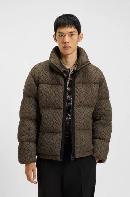 Puffer jacket with cable-knit structure