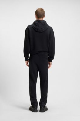 Cotton-blend tracksuit bottoms with waxed-stamp logo, Black