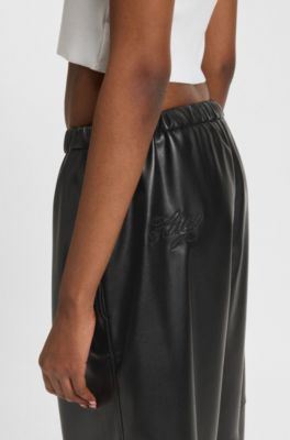 Wide-leg parachute trousers in faux leather, Black