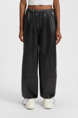 Wide-leg parachute trousers in faux leather, Black