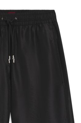 Pantalones relaxed fit de pernera ancha con cord&oacute;n en la cintura, Negro