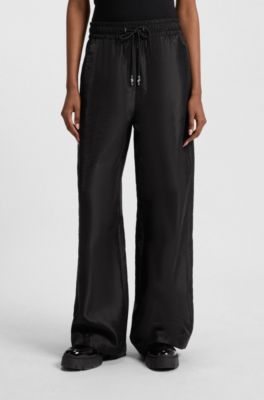 Pantalones relaxed fit de pernera ancha con cord&oacute;n en la cintura, Negro