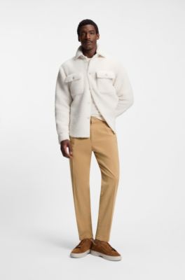 Pantalones tapered fit en sarga el&aacute;stica, Beige