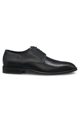 Chaussures derby en cuir aux finitions structur&eacute;es et unies, Noir