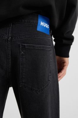 Black tapered-fit jeans in grain-effect denim, Black