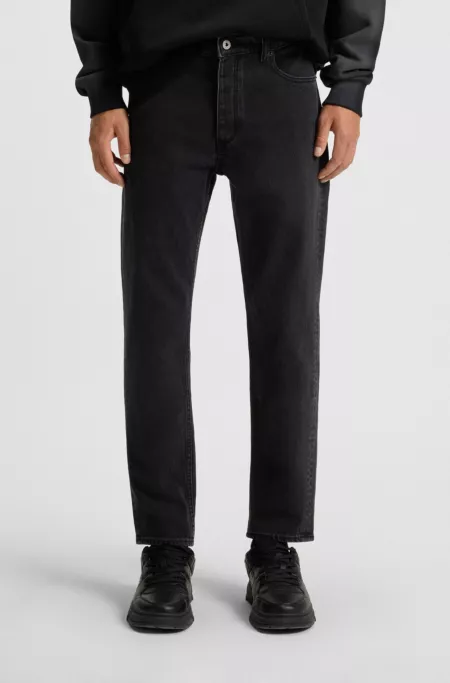 Black tapered-fit jeans in grain-effect denim
