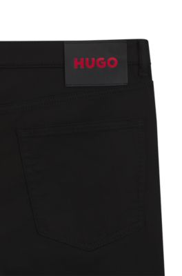 Jeans extra slim fit en denim negro de tacto satinado, Negro
