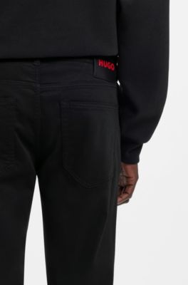 Jeans extra slim fit en denim negro de tacto satinado, Negro