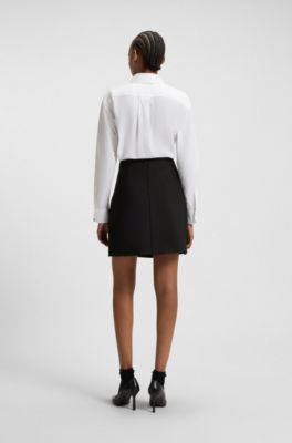 Wrap-front skirt with golden knot button, Black