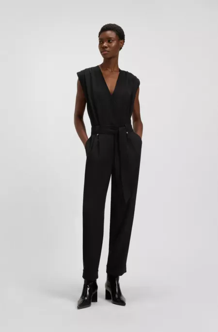 Wrap-front jumpsuit with hardware snaps