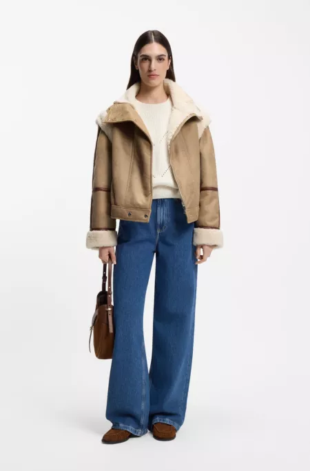 Detachable-sleeve jacket in faux shearling