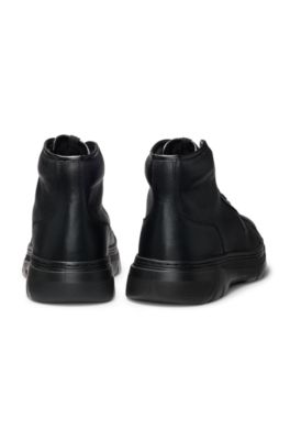 High-top boots in grained leather, Black