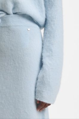 Jupe en maille avec breloque logot&eacute;e, bleu clair