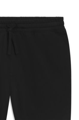 Pantalones de ch&aacute;ndal en felpa de algod&oacute;n con bordado de logo sombreado, Negro