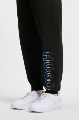 Pantalones de ch&aacute;ndal en felpa de algod&oacute;n con bordado de logo sombreado, Negro