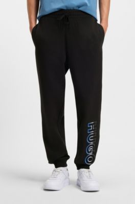 Pantalones de ch&aacute;ndal en felpa de algod&oacute;n con bordado de logo sombreado, Negro