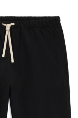 BECKHAM x BOSS relaxed tracksuit bottoms in cotton terry, Black