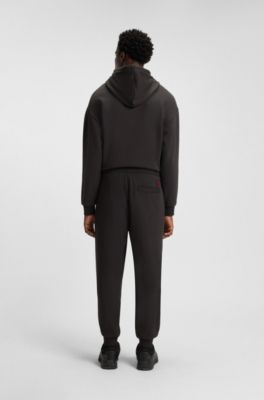 HUGO x RB bull-graphic tracksuit bottoms in cotton terry, Dark Brown