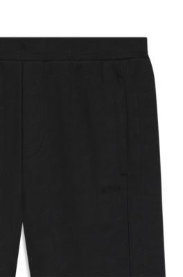 Pantalones de ch&aacute;ndal regular fit en jacquard guateado, Negro