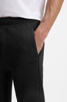 Pantalones de ch&aacute;ndal regular fit en jacquard guateado, Negro