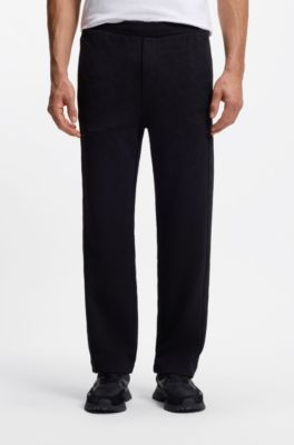 Pantalones de ch&aacute;ndal regular fit en jacquard guateado, Negro