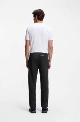 Quilted-jacquard tracksuit bottoms in a regular fit, Black