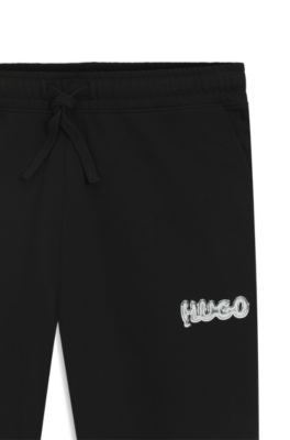 Logo-print tracksuit bottoms in cotton terry, Black