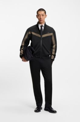 Pantalones de ch&aacute;ndal relaxed fit con cinta de logos, Negro