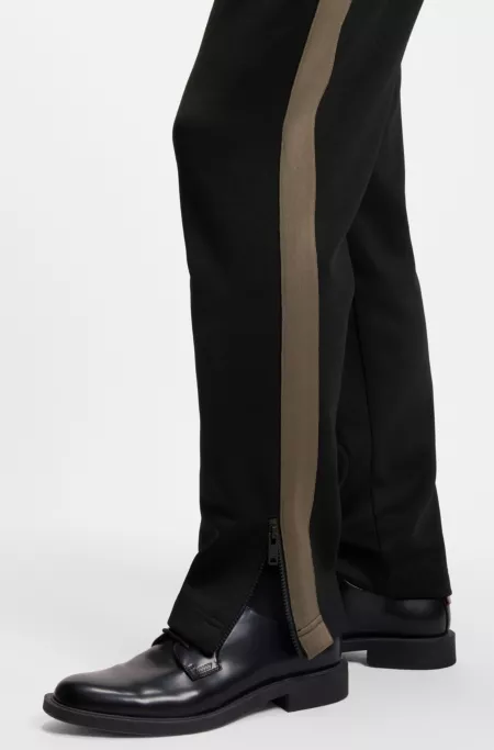 Logo-tape tracksuit bottoms in a relaxed fit