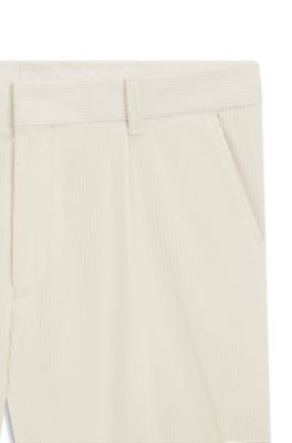 Pantalones tapered fit en pana de algod&oacute;n el&aacute;stico, Blanco