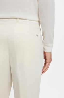 Pantalones tapered fit en pana de algod&oacute;n el&aacute;stico, Blanco