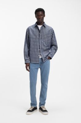 Jeans slim fit en denim el&aacute;stico azul con lavado vintage, Azul