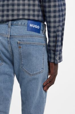 Jeans slim fit en denim el&aacute;stico azul con lavado vintage, Azul