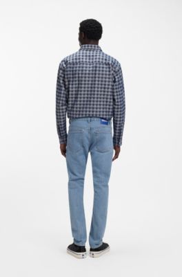 Jeans slim fit en denim el&aacute;stico azul con lavado vintage, Azul