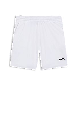 Shorts de secado rápido en tejido elástico con bolsillos amplios