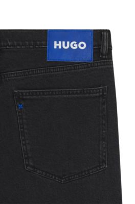 Jeans skinny fit en denim lavado con grano negro, Negro
