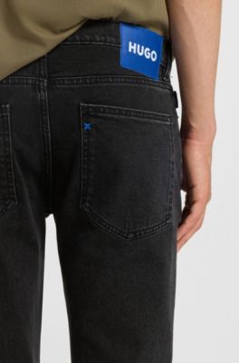Jeans skinny fit en denim lavado con grano negro, Negro