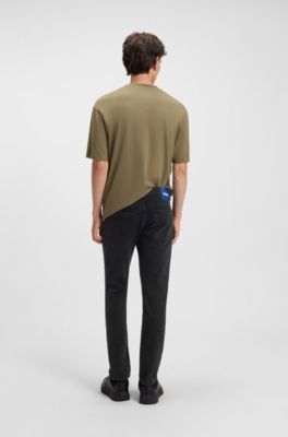 Jeans skinny fit en denim lavado con grano negro, Negro