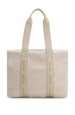Logo-strap tote bag in faux shearling